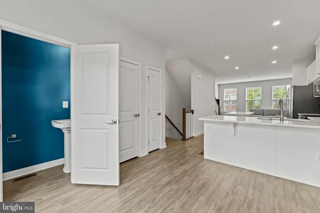 a view of kitchen with wooden floor