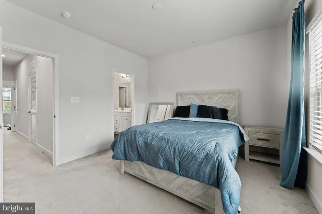 a bedroom with a bed and a walk in closet