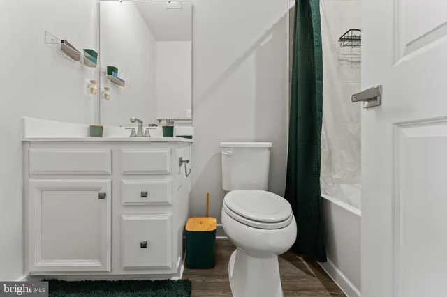 a bathroom with a toilet and a sink