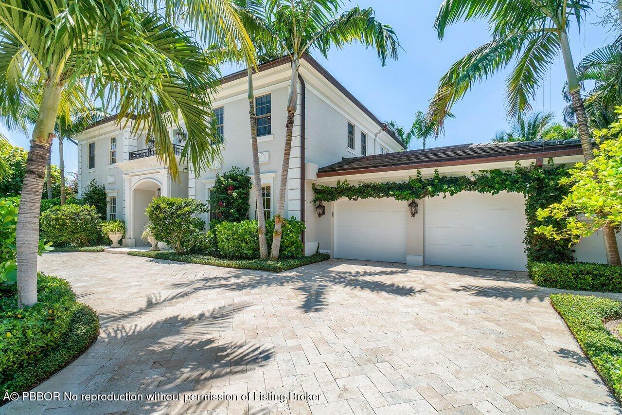 134 Seagate Road Palm Beach, FL 33480 - Photo 2 of 29 a front view of a house with a yard and a garage