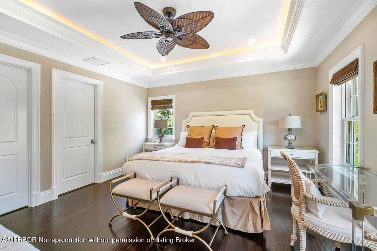 134 Seagate Road Palm Beach, FL 33480 - Photo 23 of 29 a bedroom with a bed and a table in it