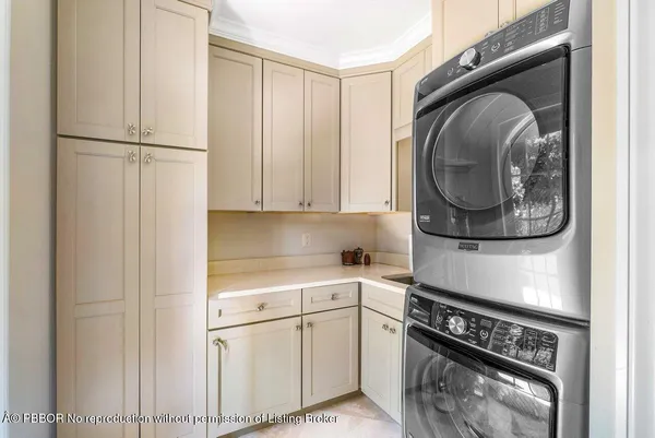 a kitchen with a white stove and white cabinets