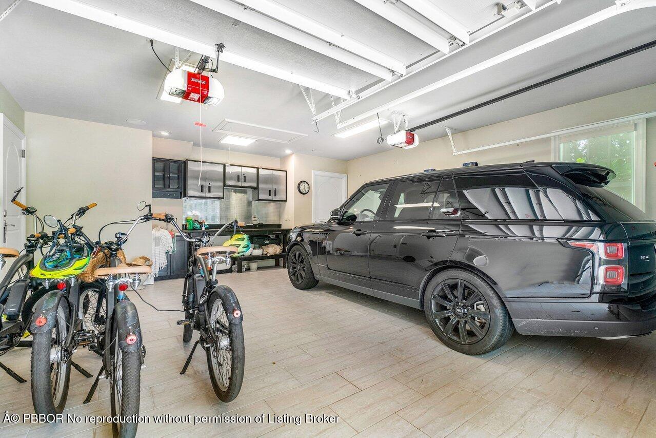 134 Seagate Road Palm Beach, FL 33480 - Photo 26 of 29 a view of parking garage with cars