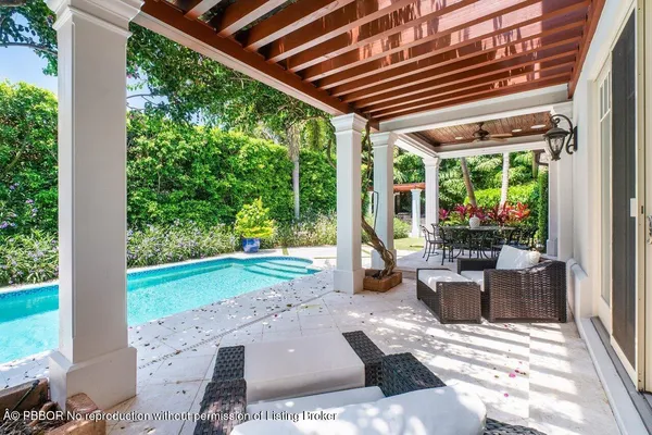 a patio with yard table and chairs
