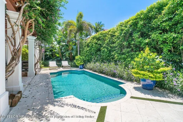 a view of a swimming pool with a patio