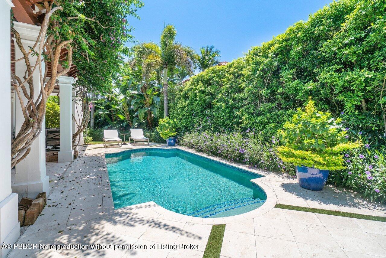 134 Seagate Road Palm Beach, FL 33480 - Photo 28 of 29 a view of a swimming pool with a patio