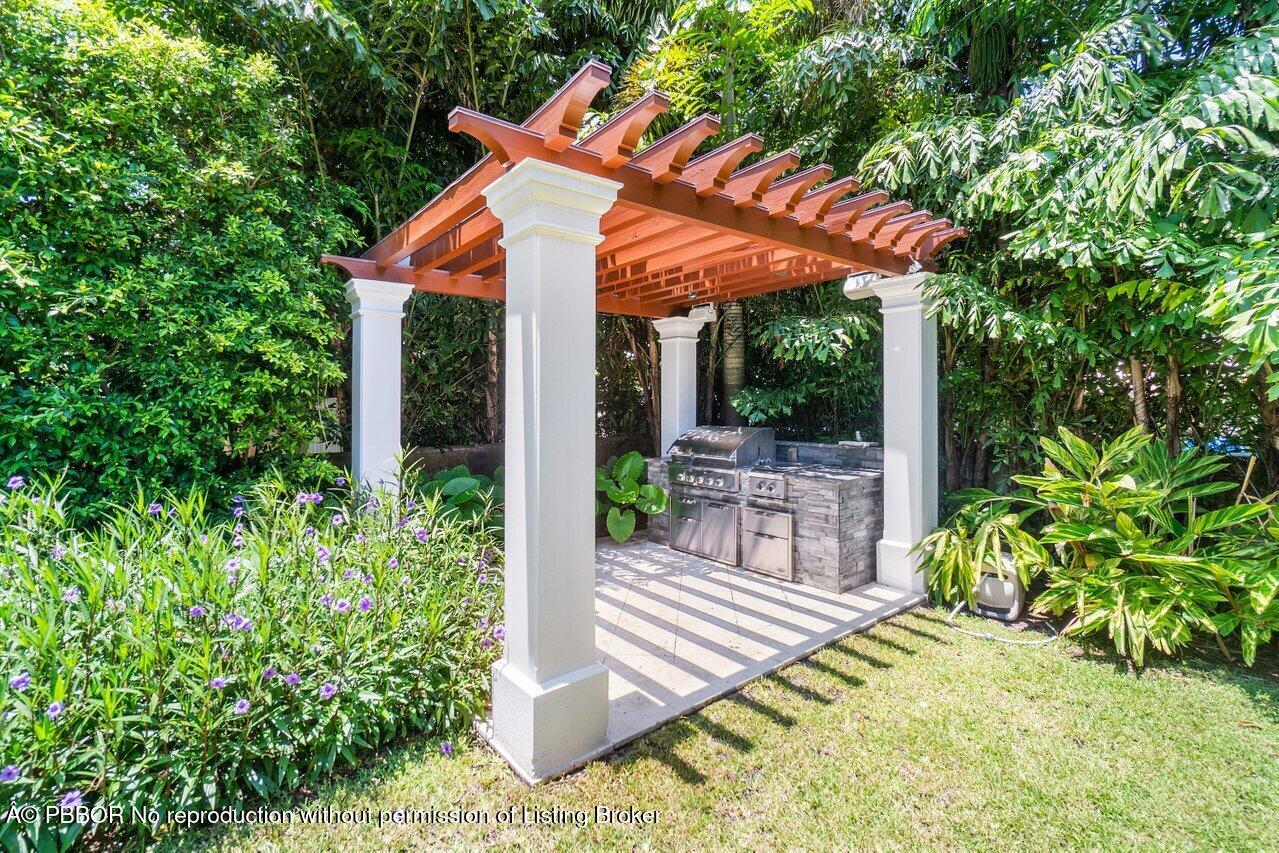 134 Seagate Road Palm Beach, FL 33480 - Photo 29 of 29 a view of house with backyard and sitting area