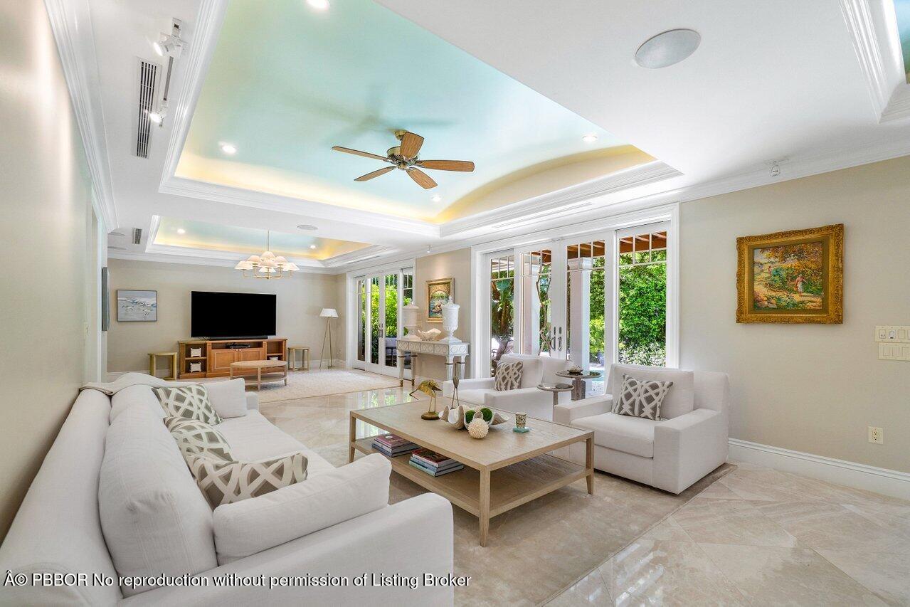 134 Seagate Road Palm Beach, FL 33480 - Photo 6 of 29 a living room with furniture and a flat screen tv