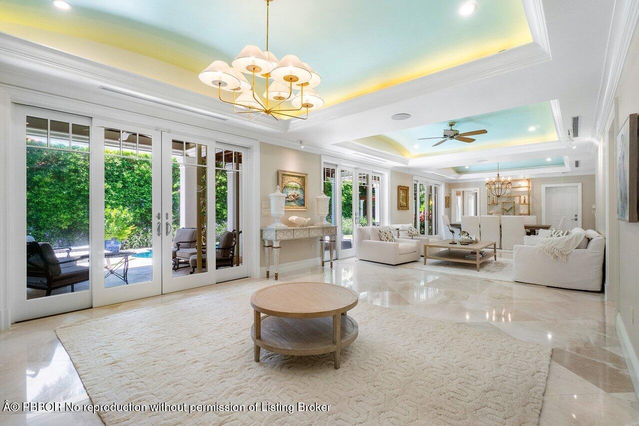 134 Seagate Road Palm Beach, FL 33480 - Photo 8 of 29 a lobby with furniture and floor to ceiling window