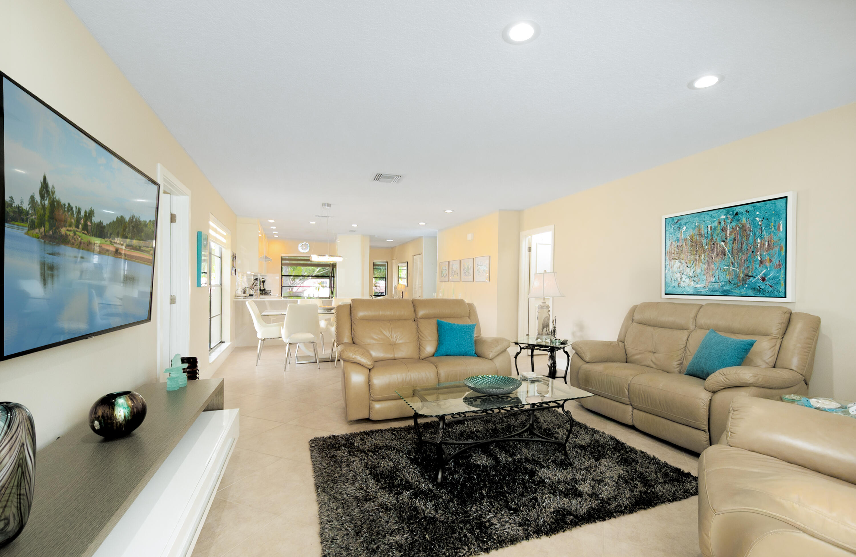 21703 Tall Palm Circle, Unit 5D Boca Raton, FL 33433 - Photo 12 of 36 a living room with furniture and wooden floor