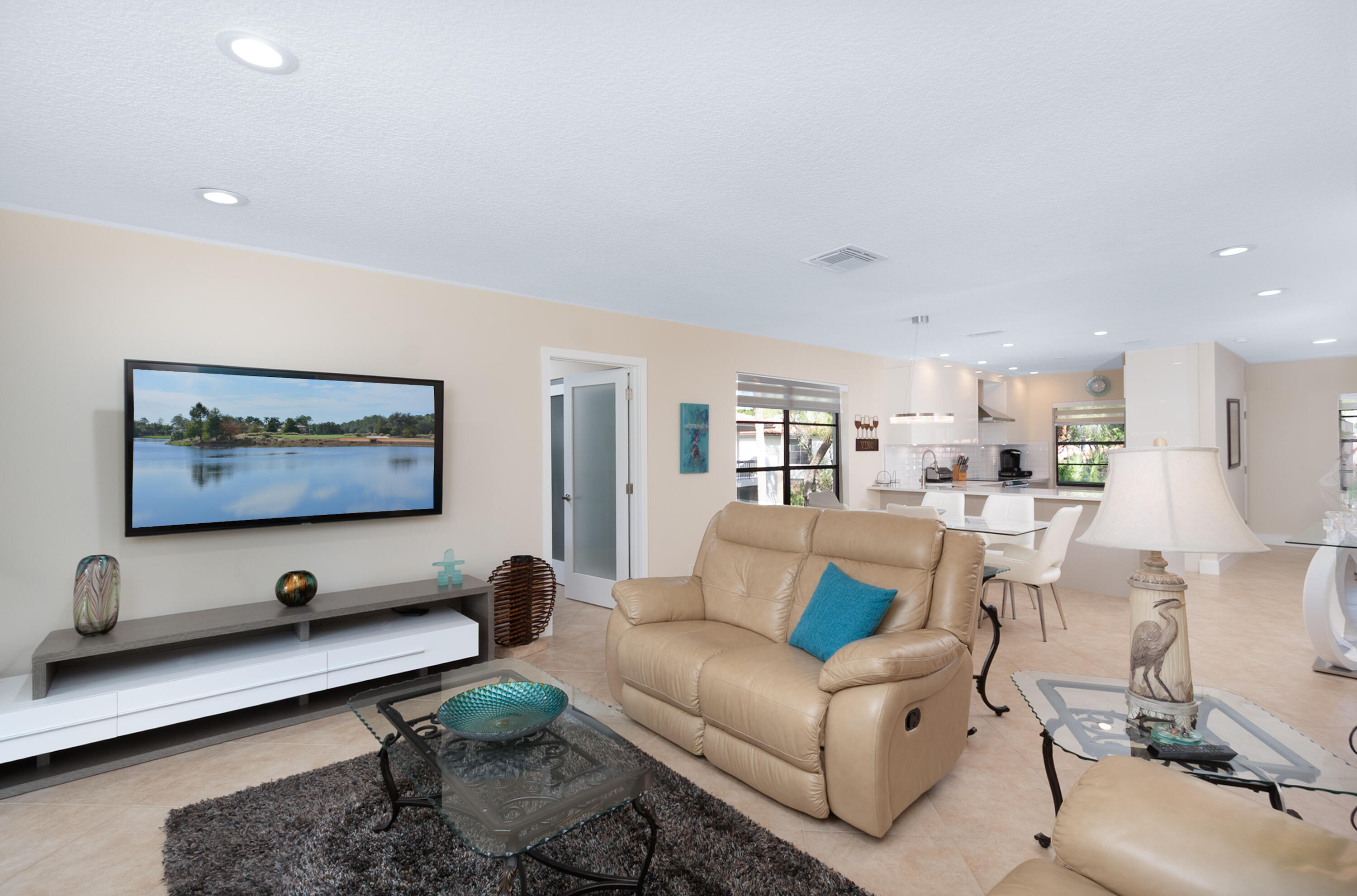 21703 Tall Palm Circle, Unit 5D Boca Raton, FL 33433 - Photo 13 of 36 a living room with furniture pool table and a flat screen tv