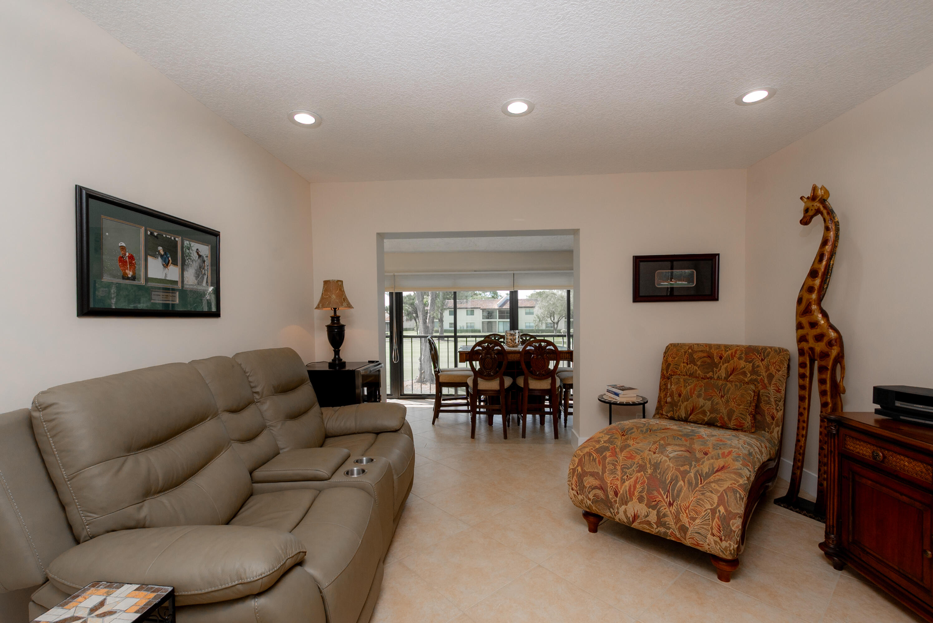 21703 Tall Palm Circle, Unit 5D Boca Raton, FL 33433 - Photo 15 of 36 a living room with furniture and a wooden floor
