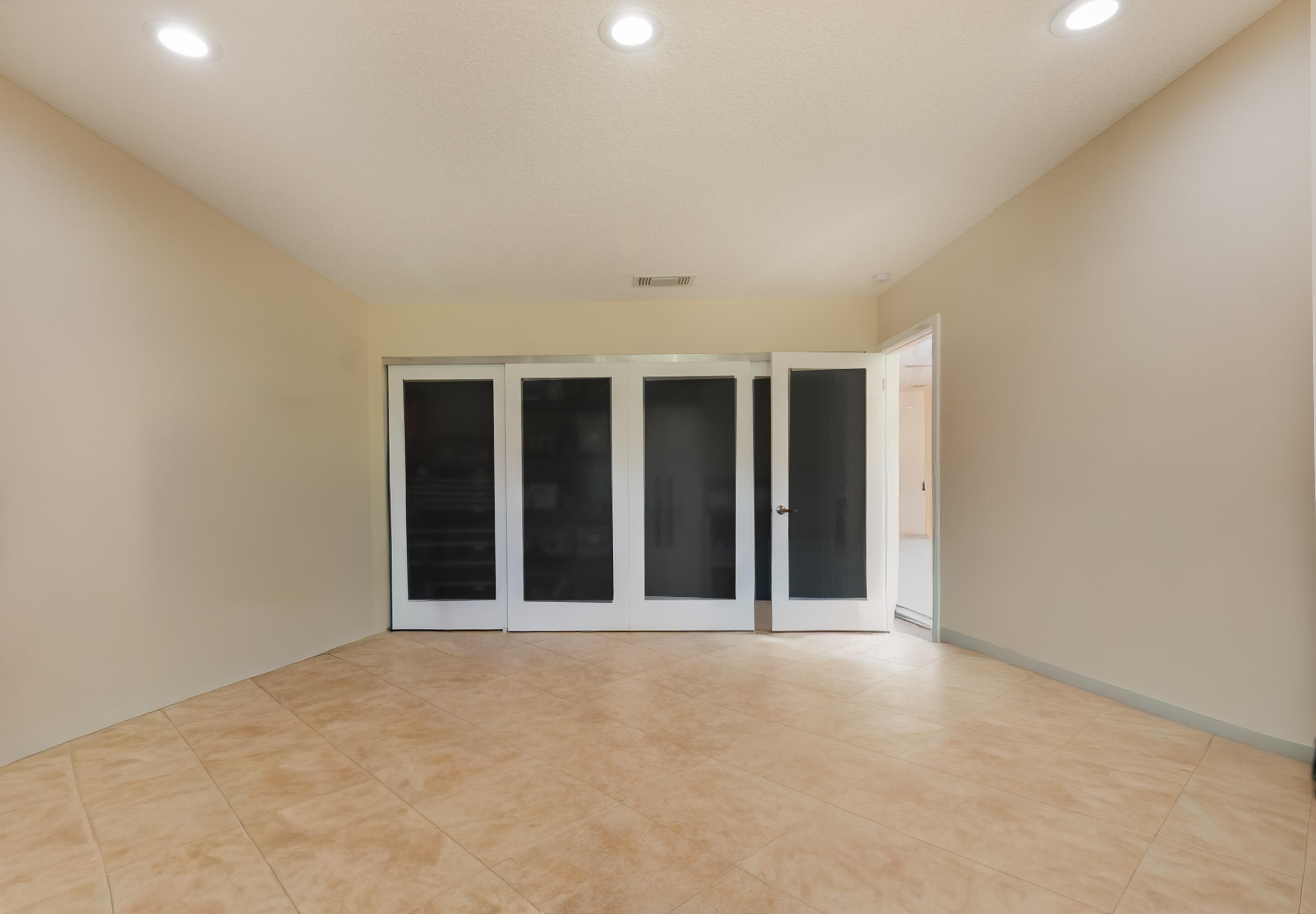 21703 Tall Palm Circle, Unit 5D Boca Raton, FL 33433 - Photo 17 of 36 a view of an empty room with a window