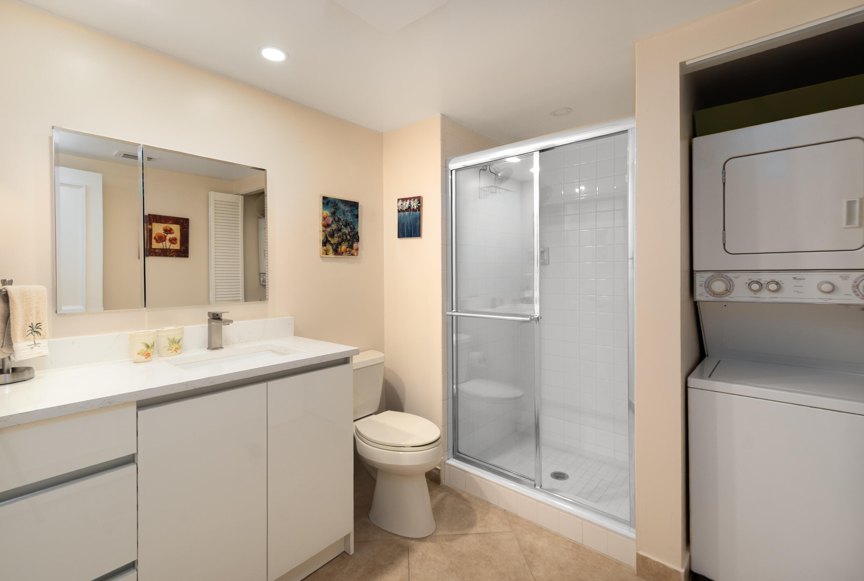 21703 Tall Palm Circle, Unit 5D Boca Raton, FL 33433 - Photo 28 of 36 a bathroom with a granite countertop sink toilet and shower