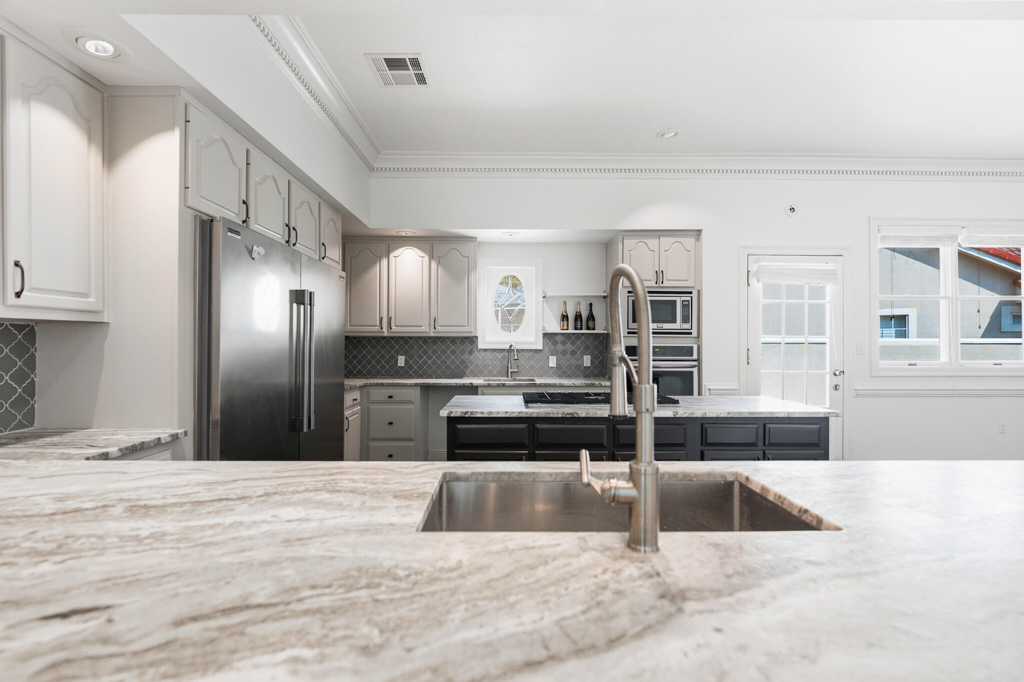 8 Weekewachee Circle Destin, FL 32541 - Photo 11 of 59 a large kitchen with kitchen island a sink stainless steel appliances and cabinets