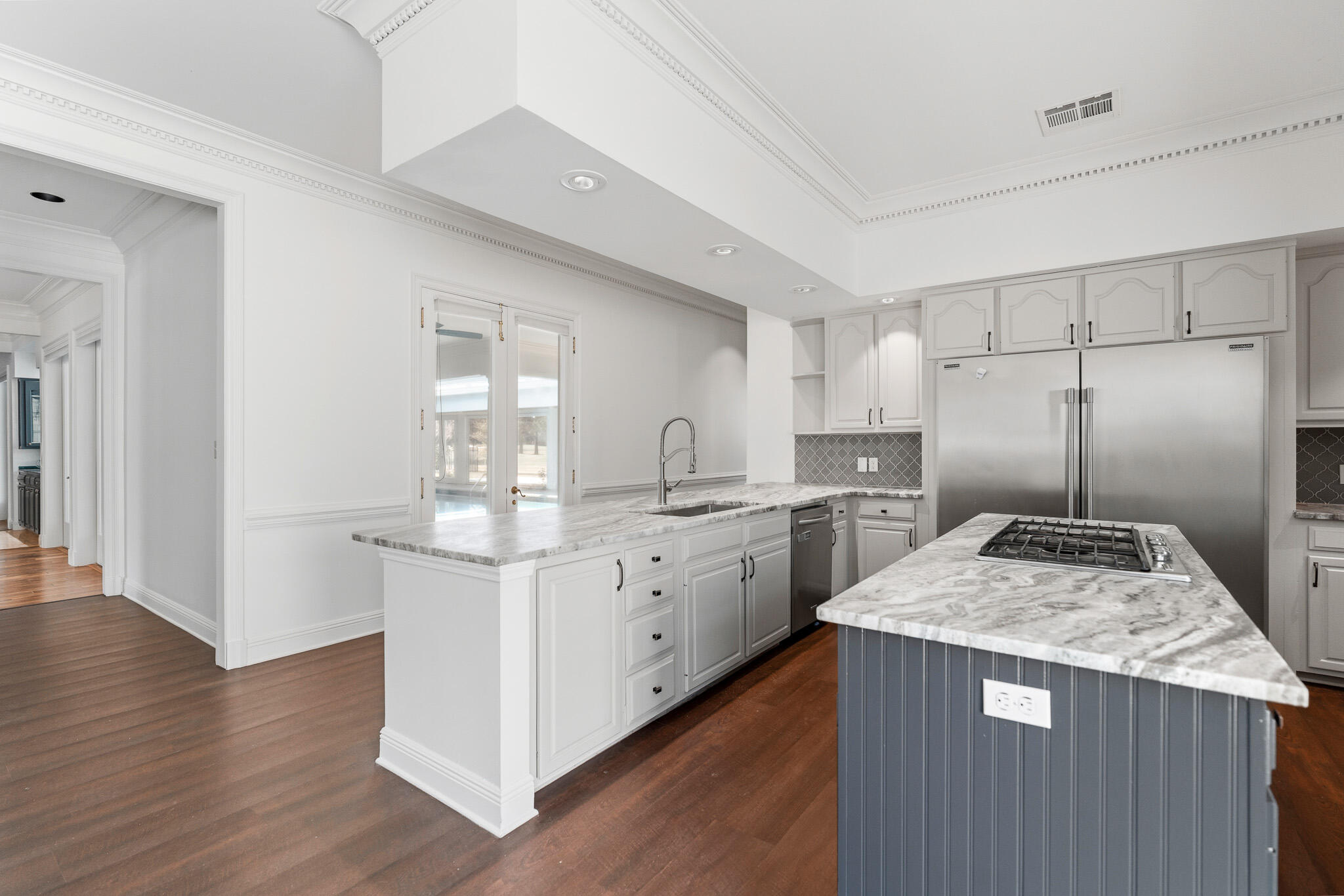 8 Weekewachee Circle Destin, FL 32541 - Photo 13 of 59 a kitchen with kitchen island granite countertop a sink and refrigerator