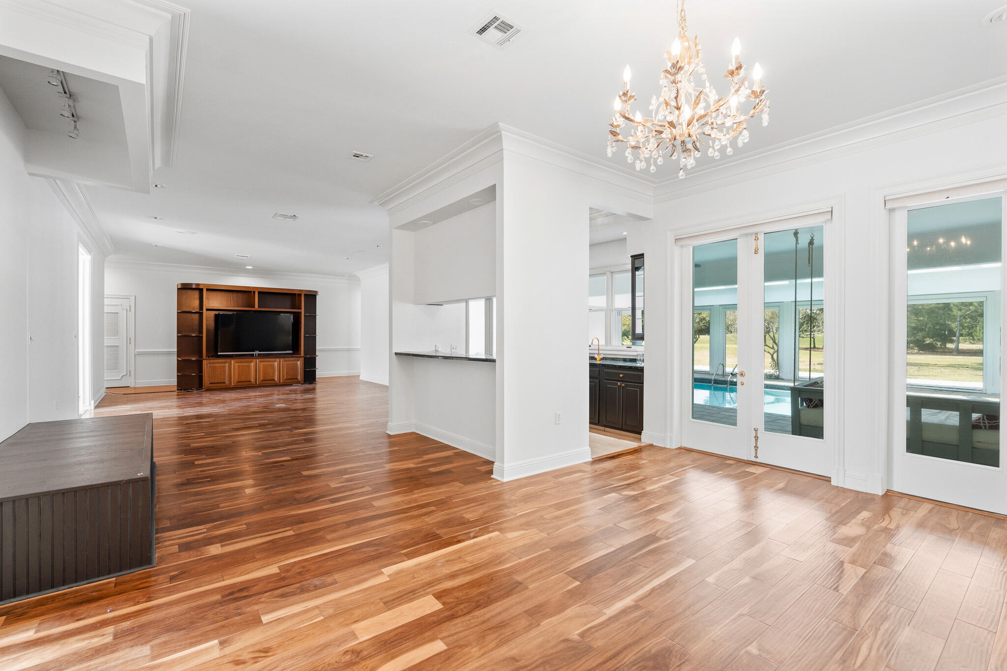 8 Weekewachee Circle Destin, FL 32541 - Photo 19 of 59 a view of a livingroom with wooden floor and a kitchen