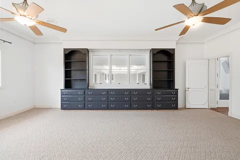 a view of a kitchen with a sink and cabinets