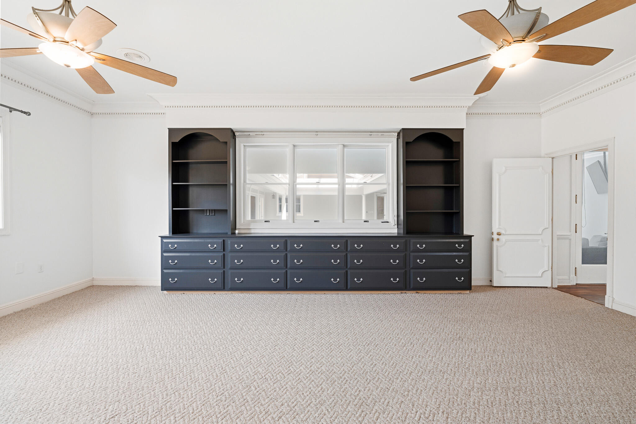 8 Weekewachee Circle Destin, FL 32541 - Photo 28 of 59 a view of wooden floor and a chandelier fan in a room