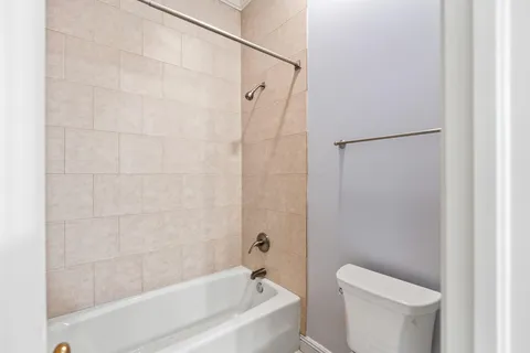 a bathroom with a bathtub and a sink