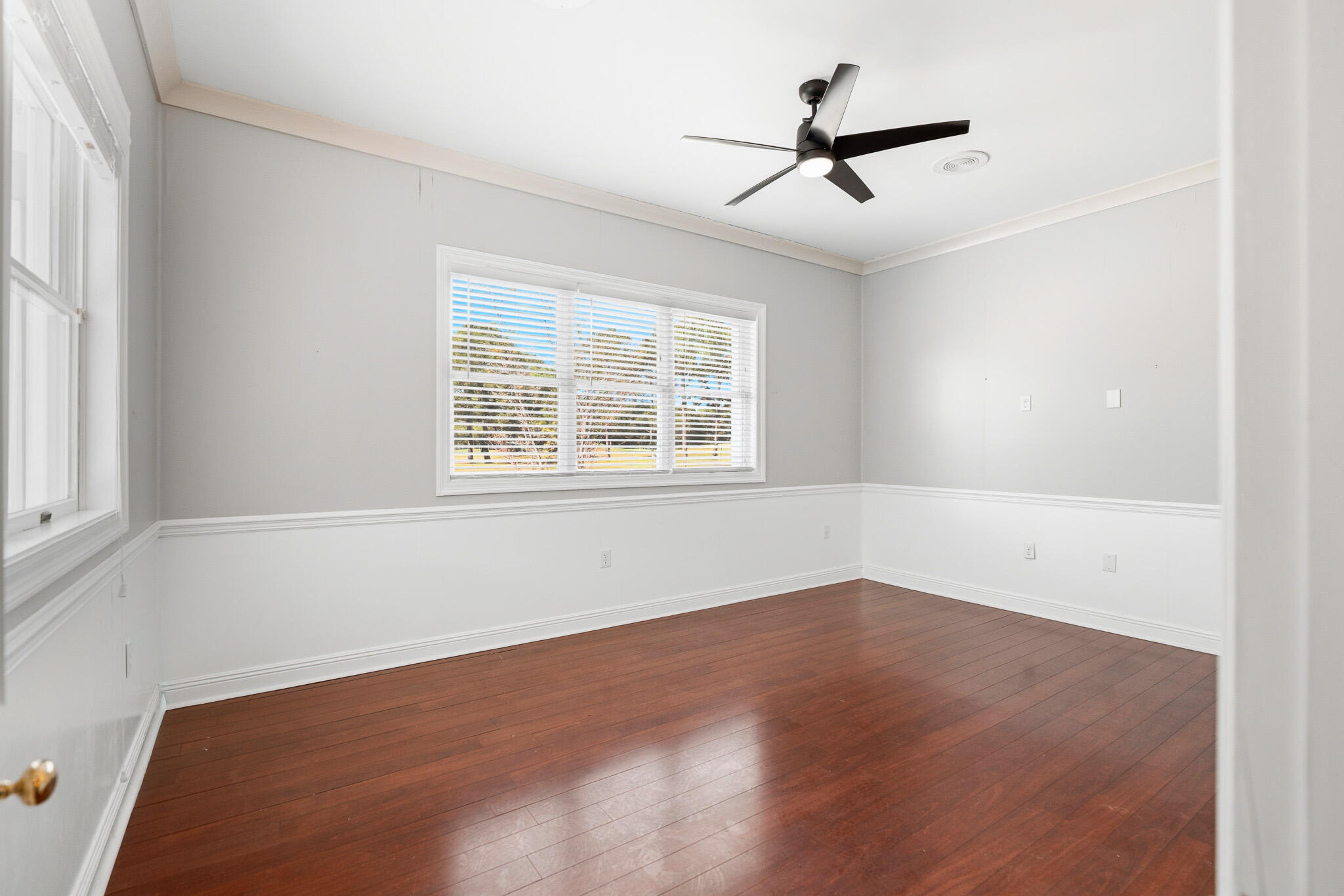 8 Weekewachee Circle Destin, FL 32541 - Photo 44 of 59 an empty room with ceiling fan and windows