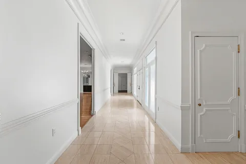 a large kitchen with kitchen island a sink stainless steel appliances and cabinets