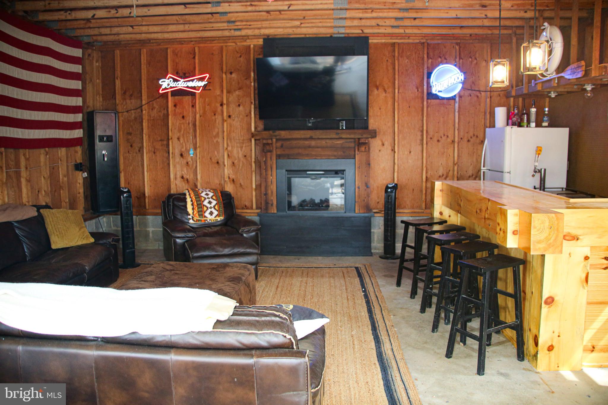120 Rock Lodge Road McHenry, MD 21541 - Photo 21 of 23 a living room with furniture and a fireplace