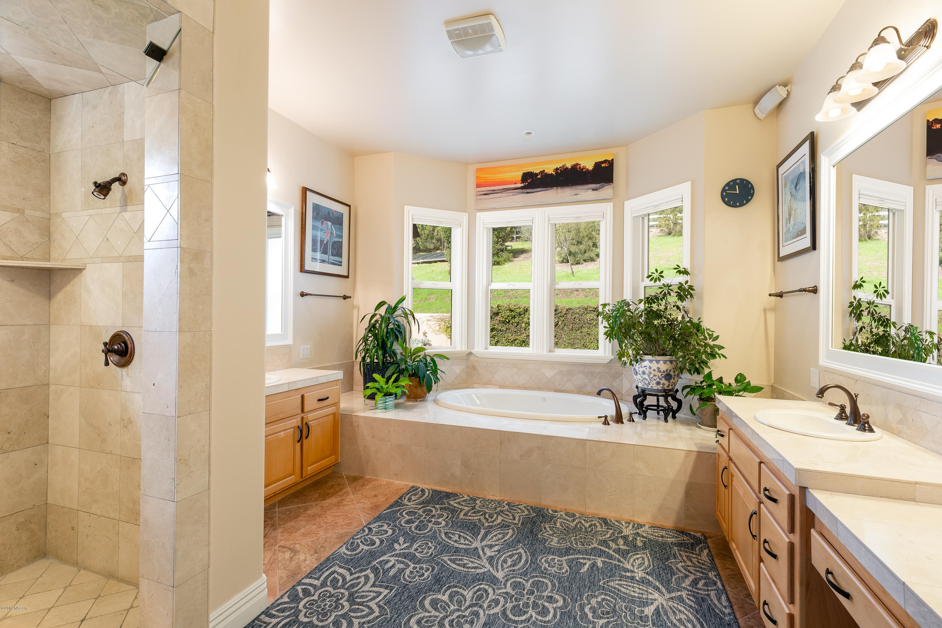 949 Old Ranch Road Solvang, CA 93463 - Photo 12 of 27 a spacious bathroom with a tub sink and mirror