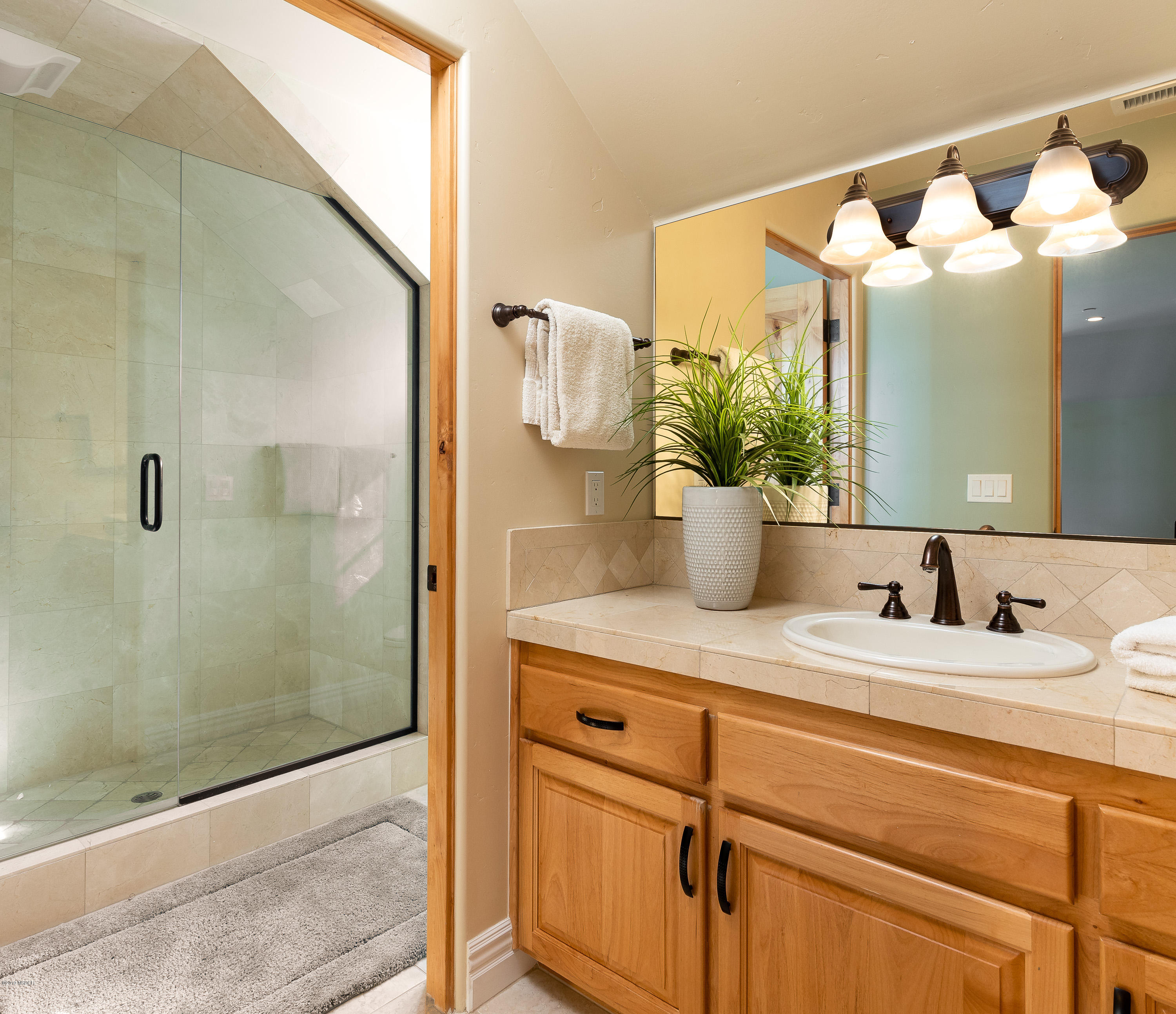 949 Old Ranch Road Solvang, CA 93463 - Photo 16 of 27 a bathroom with a granite countertop sink mirror and vanity