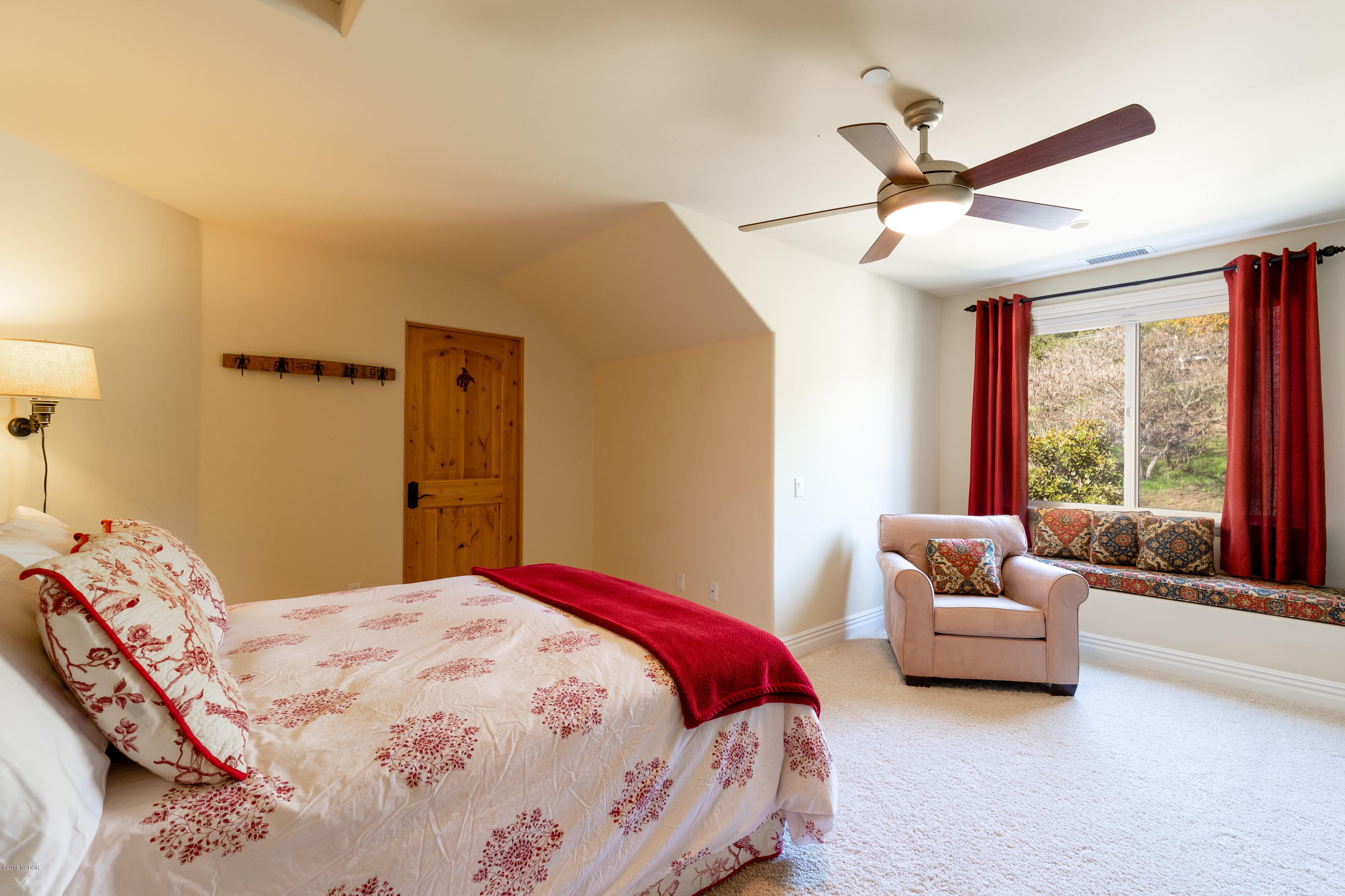 949 Old Ranch Road Solvang, CA 93463 - Photo 18 of 27 a bedroom with a bed and a large window