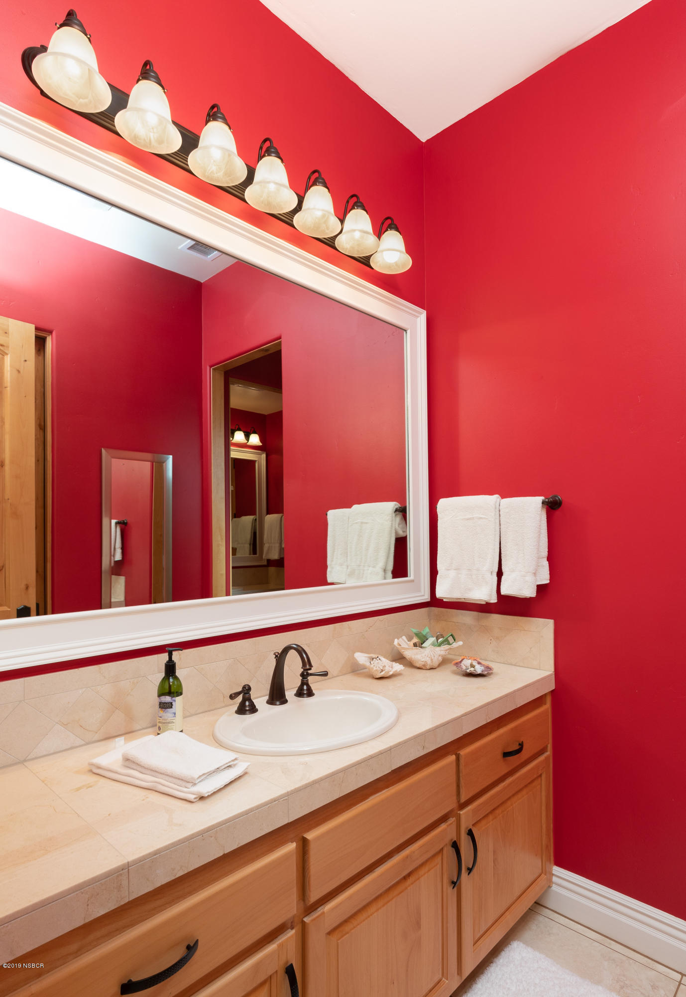 949 Old Ranch Road Solvang, CA 93463 - Photo 19 of 27 a bathroom with a sink and a mirror