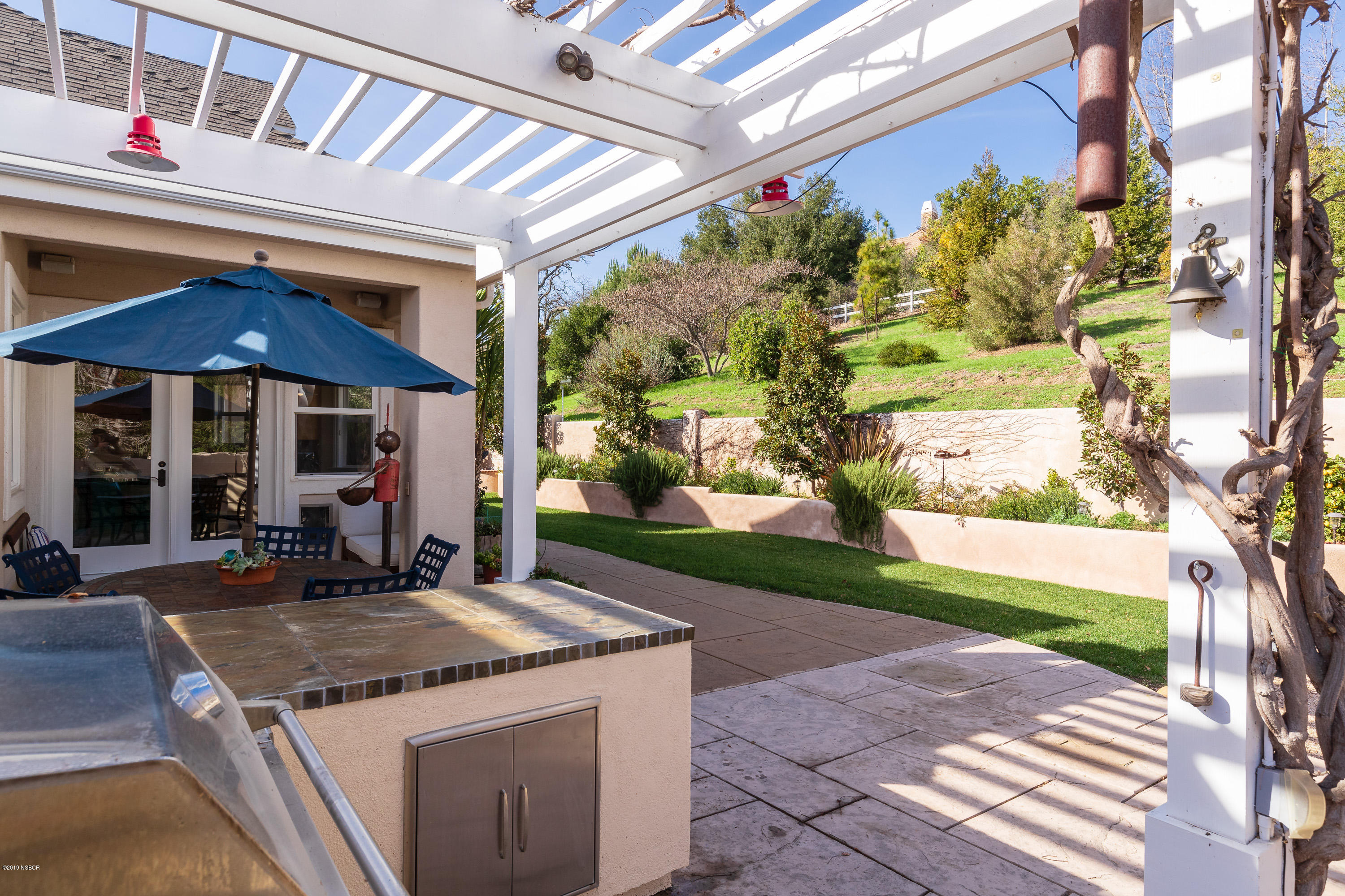 949 Old Ranch Road Solvang, CA 93463 - Photo 23 of 27 a view of a house with backyard porch and sitting area