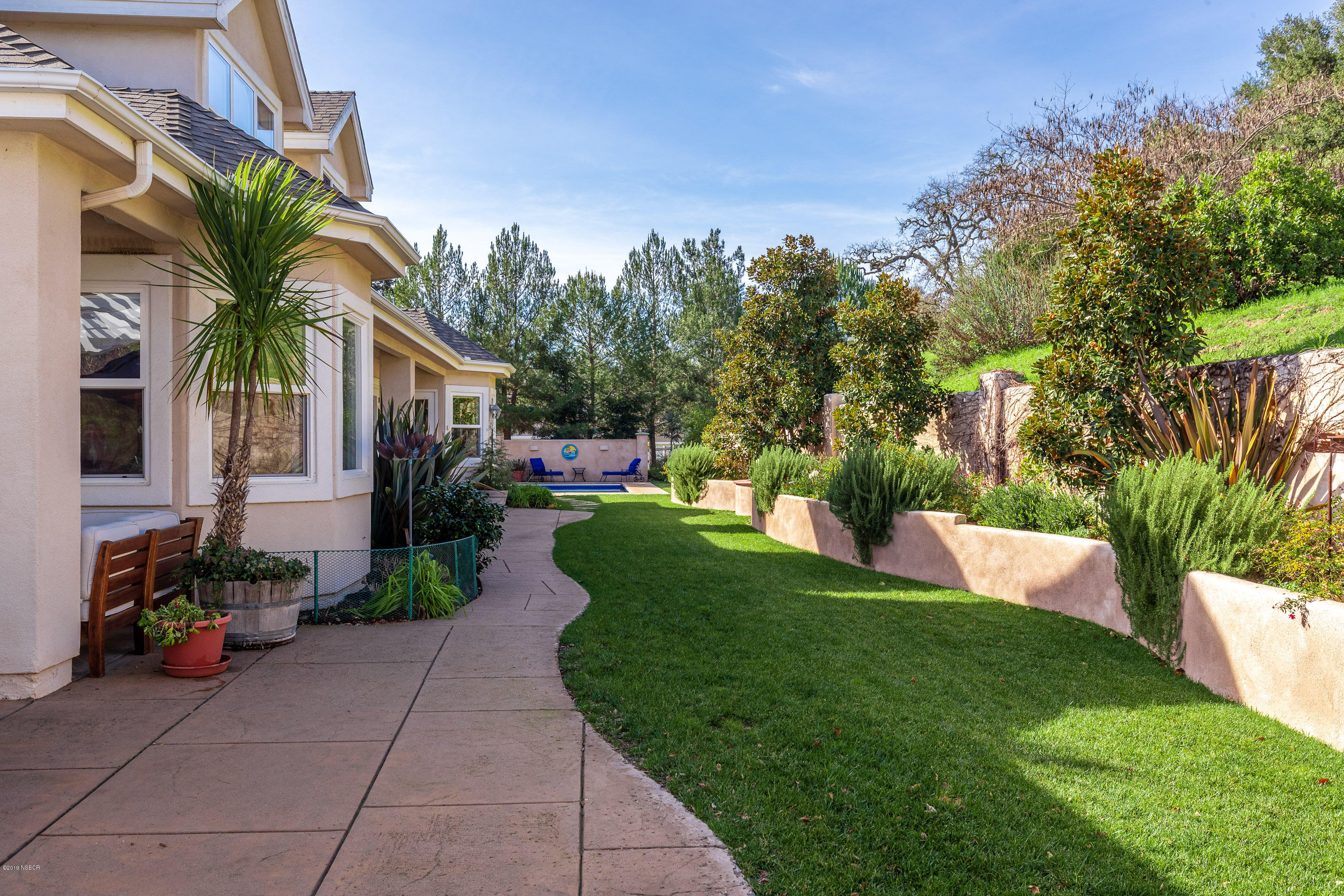 949 Old Ranch Road Solvang, CA 93463 - Photo 24 of 27 a view of a house with a yard patio and fire pit