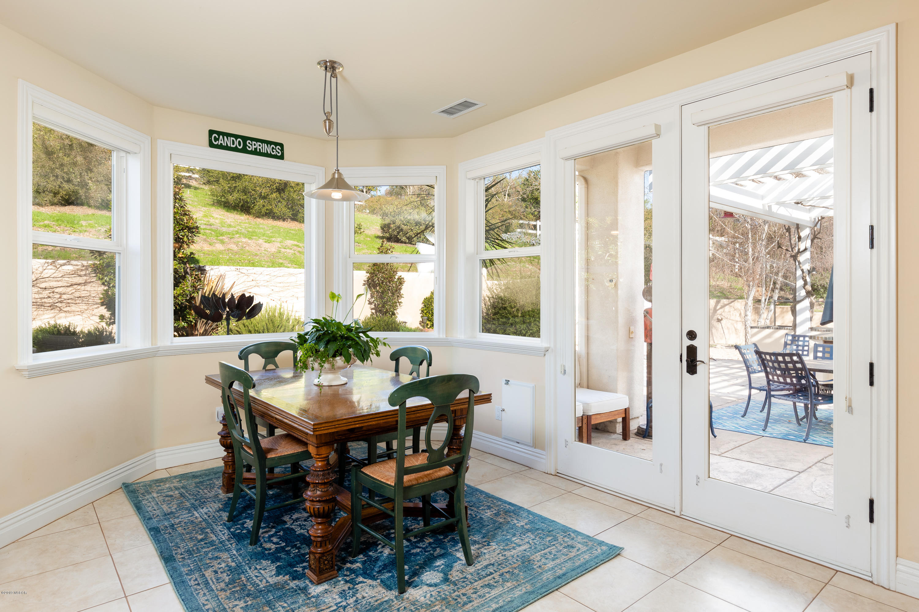 949 Old Ranch Road Solvang, CA 93463 - Photo 9 of 27 a dining room with furniture large windows and a rug