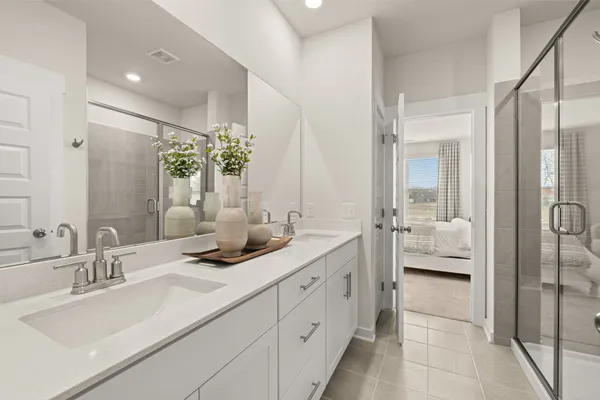a bathroom with a sink and shower