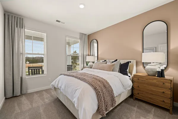 a bed room with a bed and a night stand