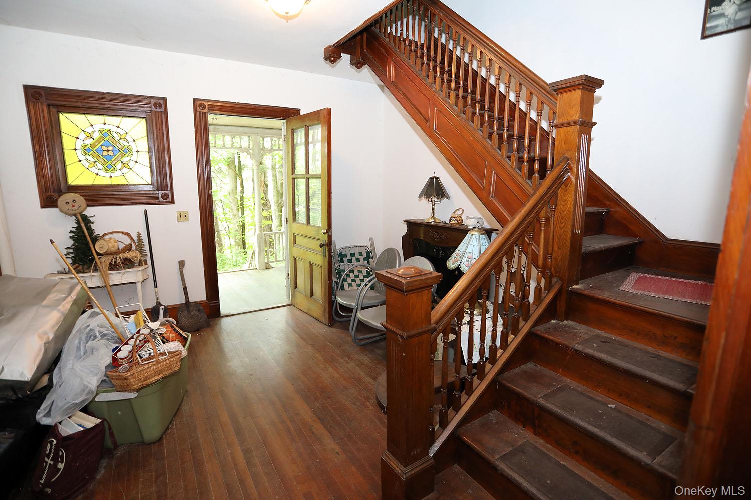 50 Parsonage Road Cochecton, NY 12726 - Photo 11 of 21 Front entryway with wood finished floors and stairway