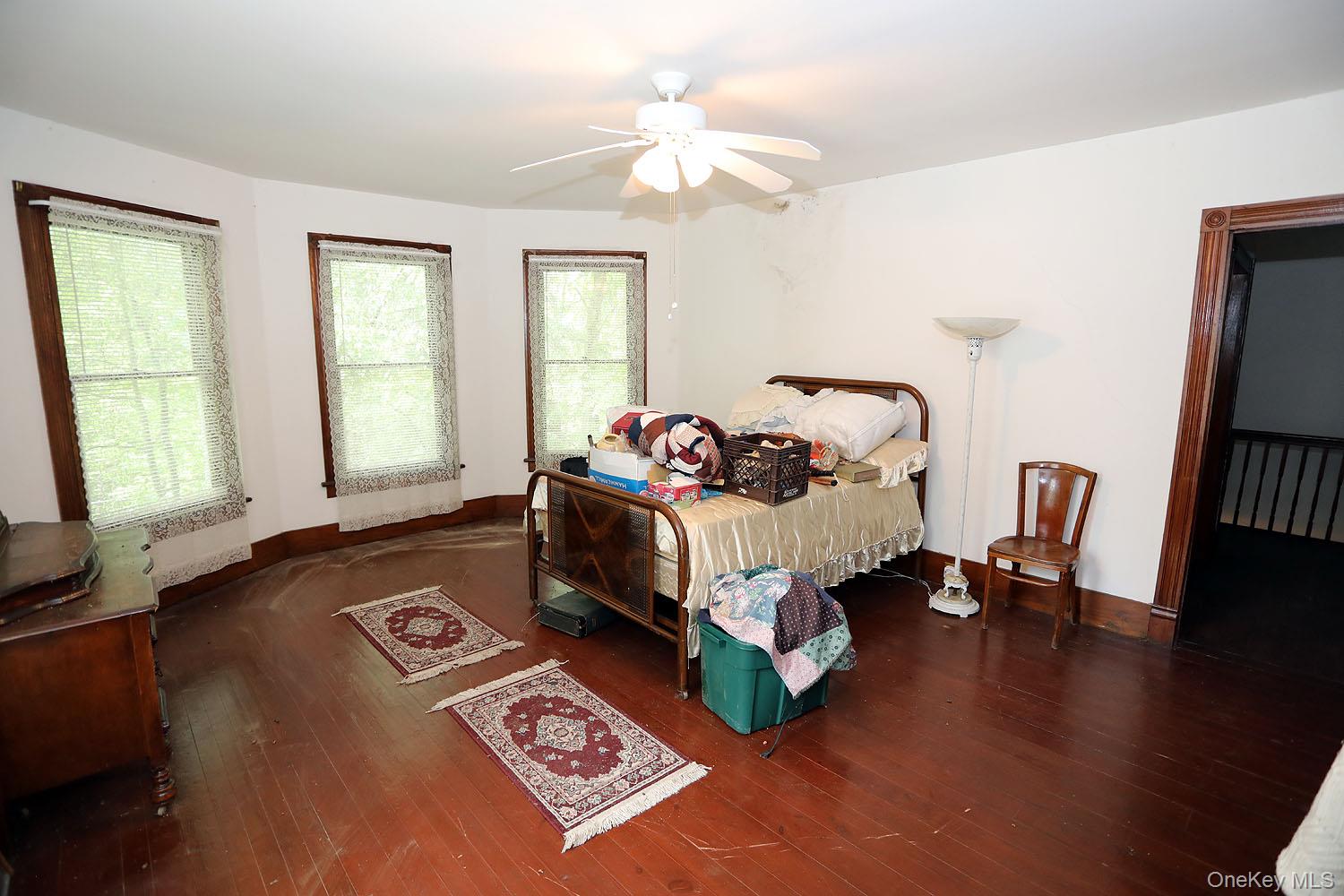 50 Parsonage Road Cochecton, NY 12726 - Photo 16 of 21 Bedroom featuring hardwood / wood-style floors and a ceiling fan