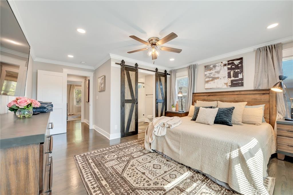 345 Pine Grove Road Roswell, GA 30075 - Photo 11 of 30 a bedroom with a bed and a chandelier