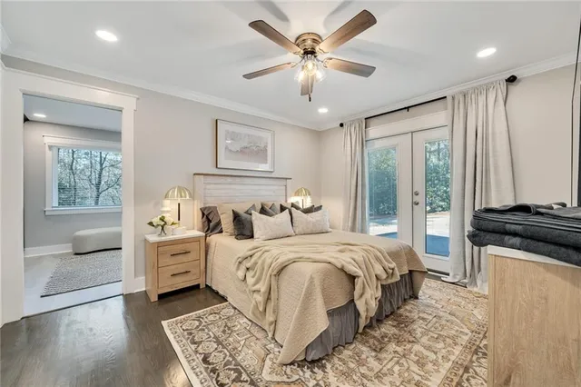 a bedroom with a large bed and a window