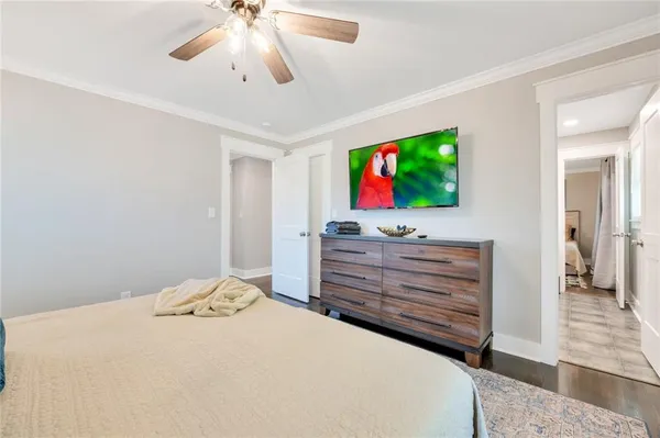 a room with a bed and a flat screen tv