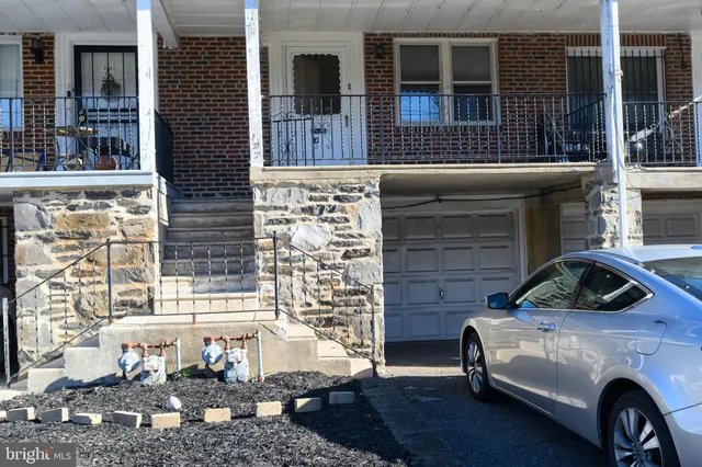 a view of a car parked in front of a building