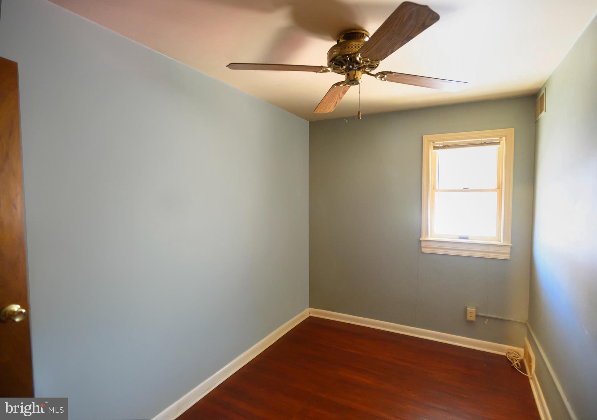 127 Sherbrook Boulevard Upper Darby, PA 19082 - Photo 15 of 24 an empty room with a window and a fan
