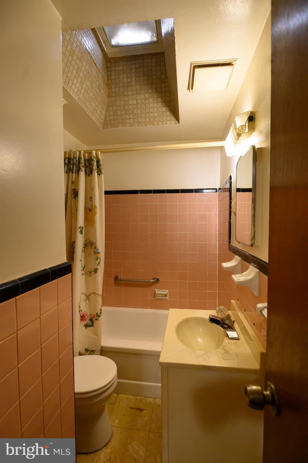 127 Sherbrook Boulevard Upper Darby, PA 19082 - Photo 17 of 24 a bathroom with a sink a toilet and shower