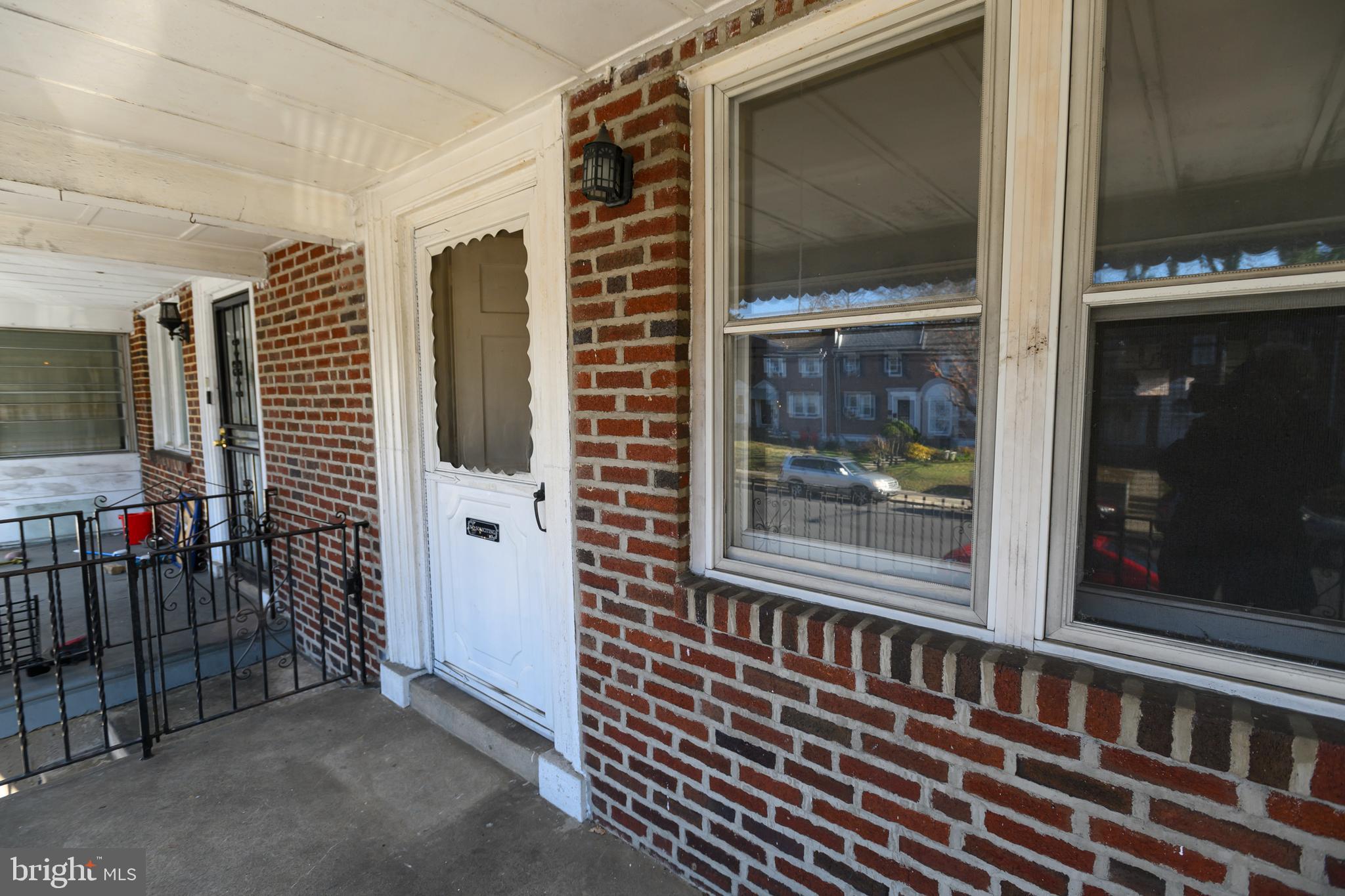 127 Sherbrook Boulevard Upper Darby, PA 19082 - Photo 2 of 24 a view of a balcony with a door and a window