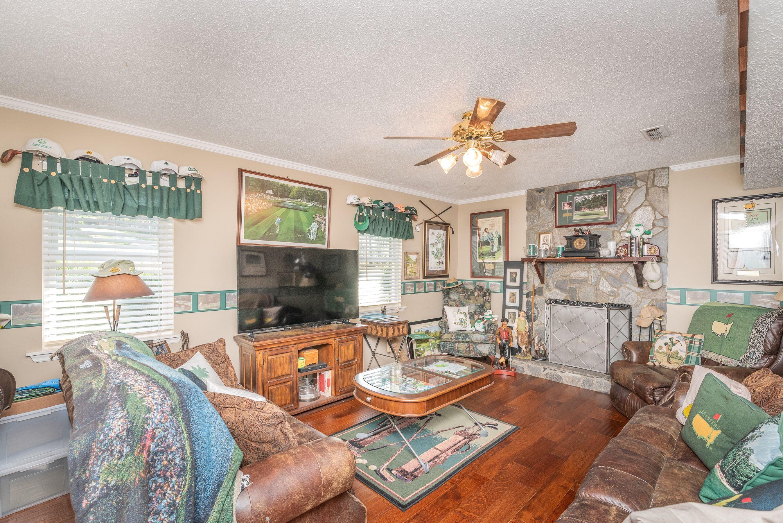 1117 Ridgemont Drive Aiken, SC 29803 - Photo 25 of 49 a living room with furniture fireplace and a large window