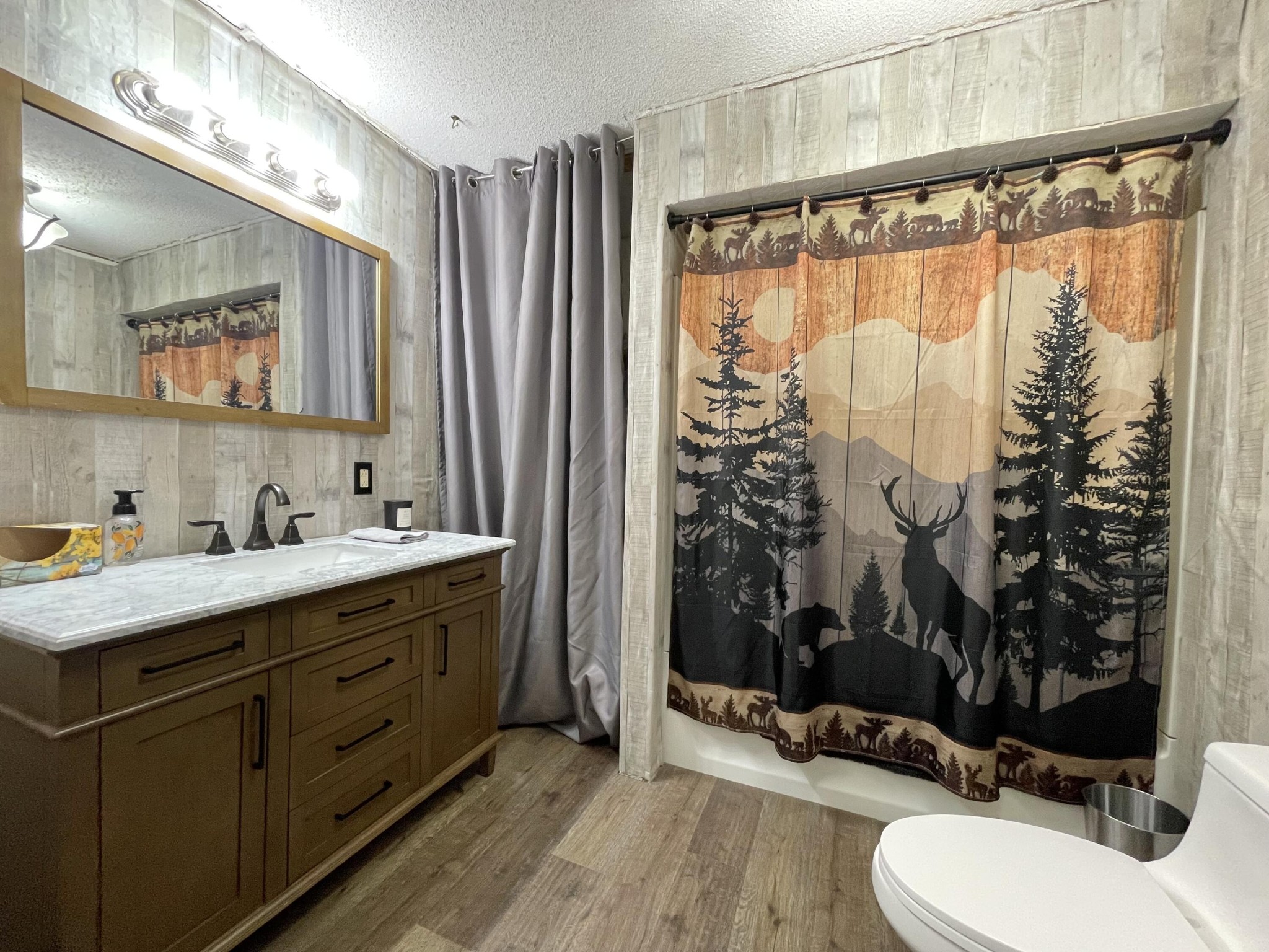 1522 Turkey Creek Road Tellico Plains, TN 37385 - Photo 23 of 34 a bathroom with a double vanity sink toilet and shower