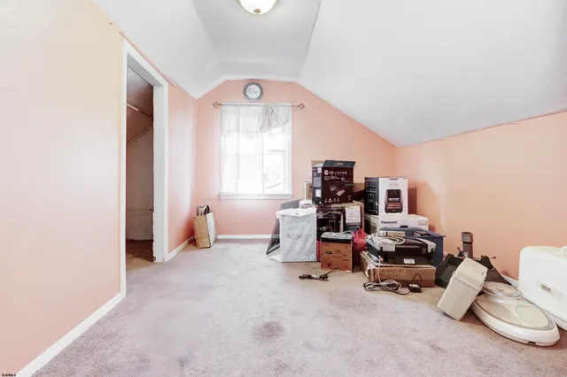 a view of a room with workspace and a window