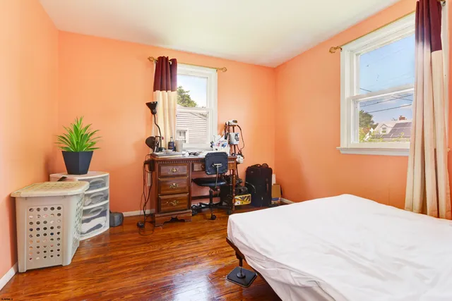 a bedroom with a bed and a desk