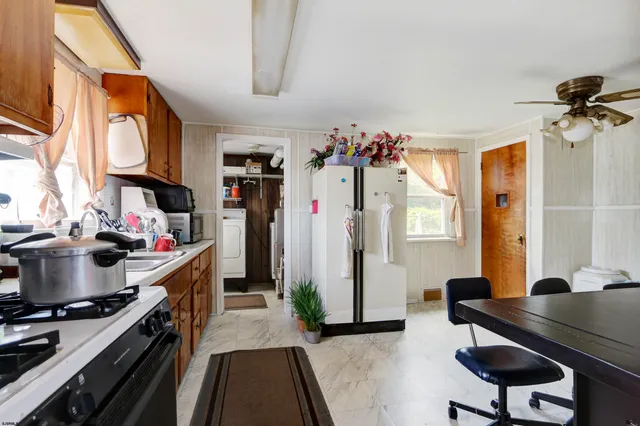 a very nice looking room with a dining table chairs